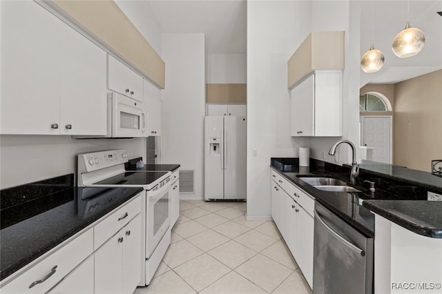 3874 E Lake Todd Dr, Hernando, FL 34442 - kitchen featuring white appliances, a sink, white cabinetry, decorative light fixtures, and light tile patterned floors