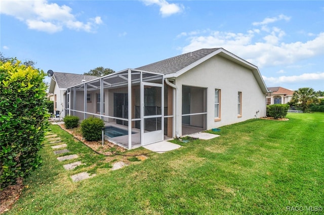 3874 E Lake Todd Dr, Hernando, FL 34442 - rear view of house with a yard, stucco siding, and glass enclosure
