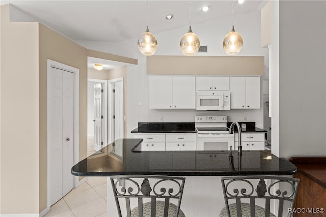 3874 E Lake Todd Dr, Hernando, FL 34442 - kitchen featuring white appliances, a kitchen breakfast bar, light tile patterned flooring, white cabinetry, and decorative light fixtures
