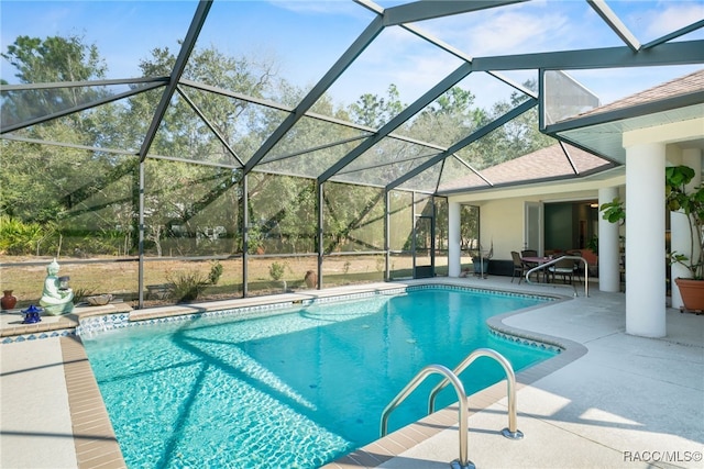 view of pool with a lanai and a patio