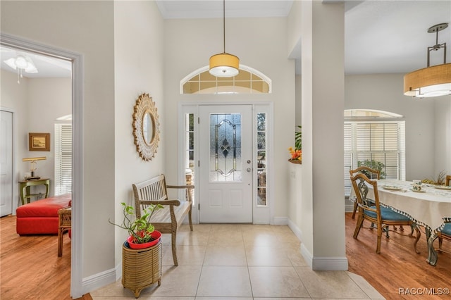 tiled foyer with crown molding