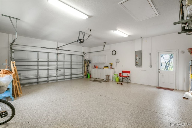 garage featuring a garage door opener and electric panel