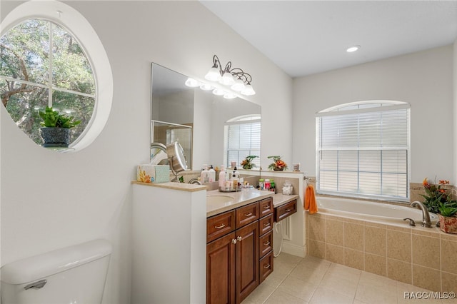 full bathroom featuring a healthy amount of sunlight, separate shower and tub, tile patterned flooring, and vanity