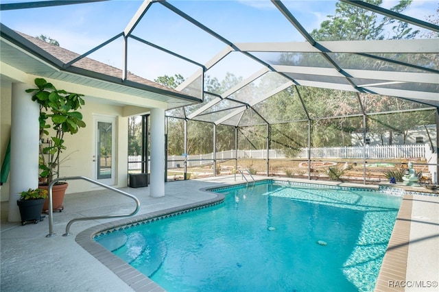 view of pool with a lanai and a patio