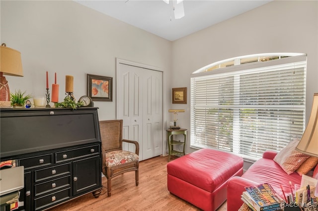 living area featuring ceiling fan and light wood-type flooring