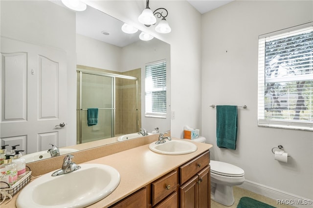 bathroom featuring a wealth of natural light, tile patterned floors, toilet, and walk in shower