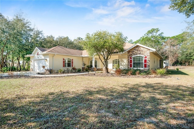 view of front of property featuring a garage and a front yard