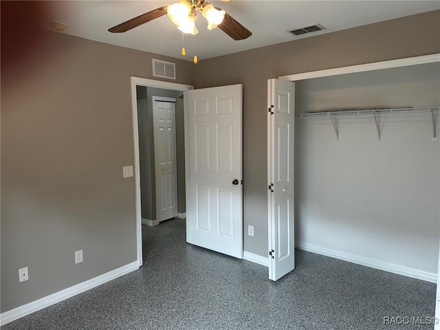 unfurnished bedroom featuring ceiling fan and a closet