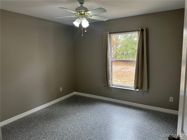 spare room with ceiling fan