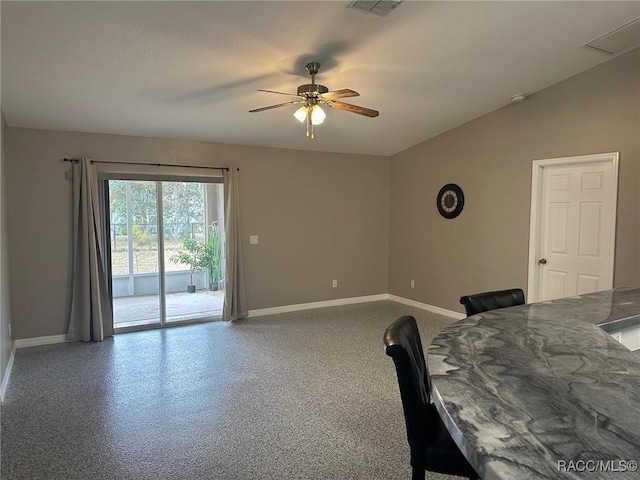 interior space featuring ceiling fan and lofted ceiling