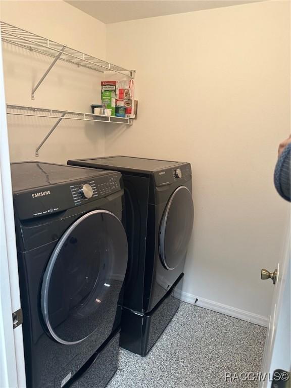 washroom with washer and dryer