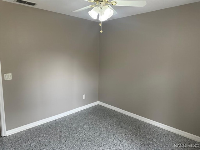 empty room with ceiling fan and carpet floors