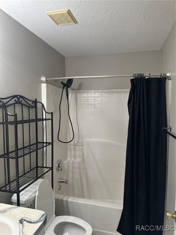 full bathroom with vanity, shower / bath combination with curtain, a textured ceiling, and toilet