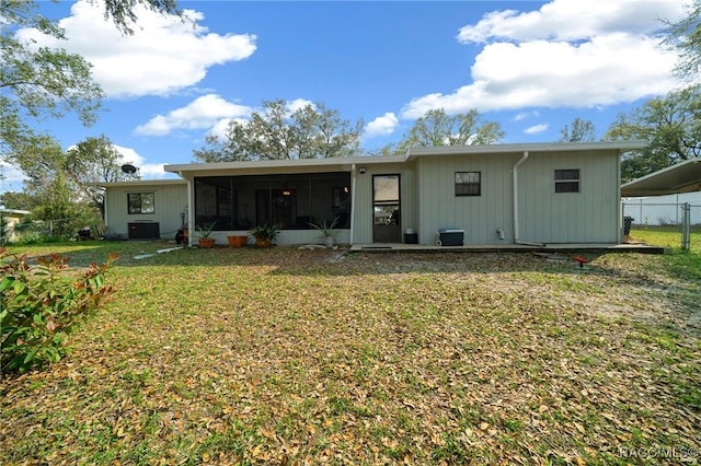 8917 SW 101st Ln, Ocala, FL 34481 - back of property featuring a sunroom, fence, central air condition unit, and a yard