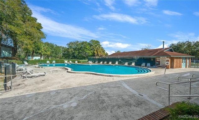 8917 SW 101st Ln, Ocala, FL 34481 - community pool featuring fence and a patio area