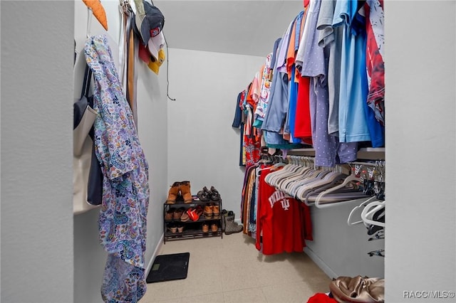 8917 SW 101st Ln, Ocala, FL 34481 - spacious closet featuring tile patterned floors