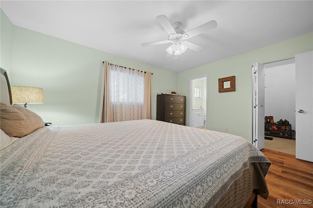 8917 SW 101st Ln, Ocala, FL 34481 - bedroom featuring a ceiling fan, connected bathroom, and wood finished floors