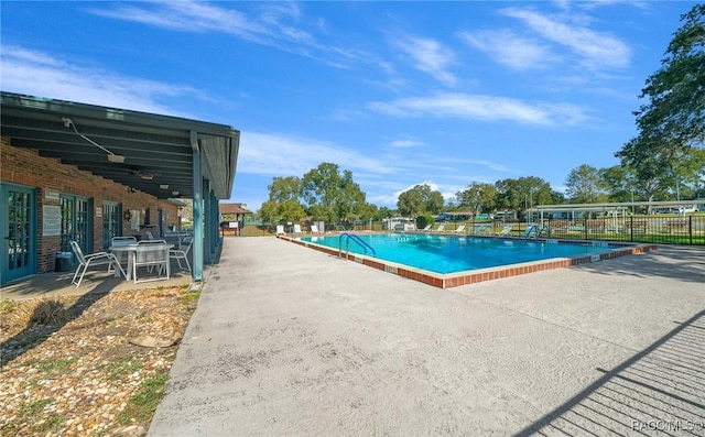 8917 SW 101st Ln, Ocala, FL 34481 - community pool with fence and a patio area