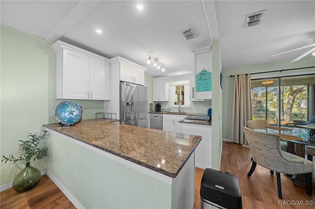 8917 SW 101st Ln, Ocala, FL 34481 - kitchen featuring wood finished floors, stainless steel appliances, and visible vents