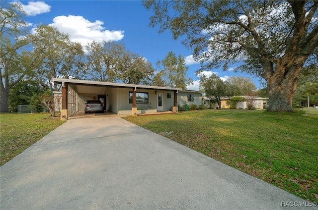 8917 SW 101st Ln, Ocala, FL 34481 - ranch-style home featuring concrete driveway, a carport, and a front lawn