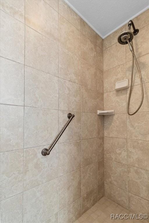 bathroom with a tile shower