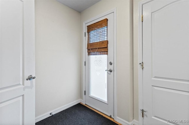 doorway with baseboards