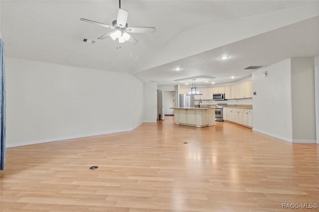 unfurnished living room featuring baseboards, visible vents, a ceiling fan, light wood-style flooring, and vaulted ceiling