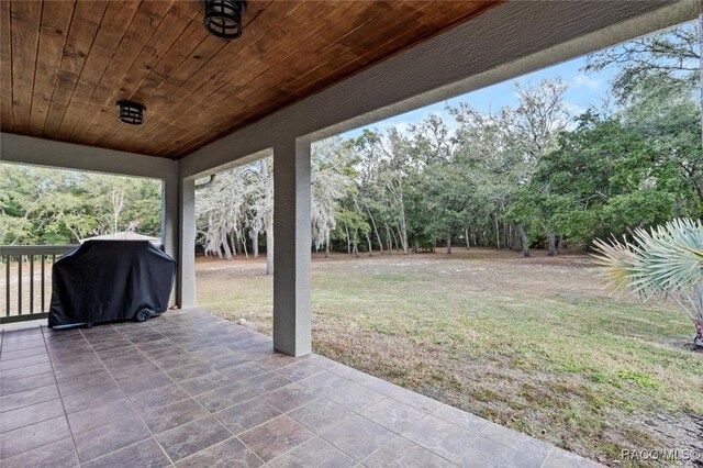 view of front of property featuring a garage, a front yard, concrete driveway, and stucco siding