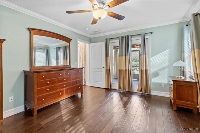 bedroom with ornamental molding, dark wood finished floors, a ceiling fan, and baseboards