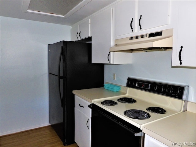 kitchen featuring electric range, hardwood / wood-style flooring, and white cabinetry