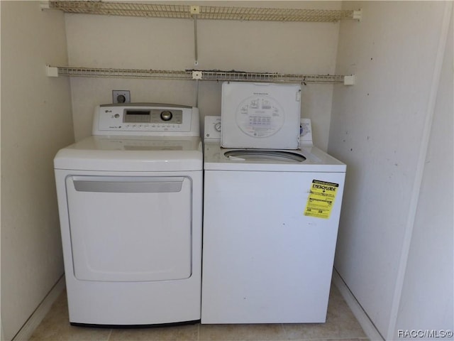 laundry room featuring separate washer and dryer