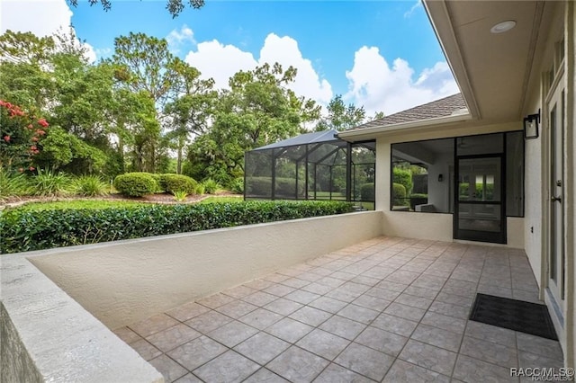 view of patio with a lanai