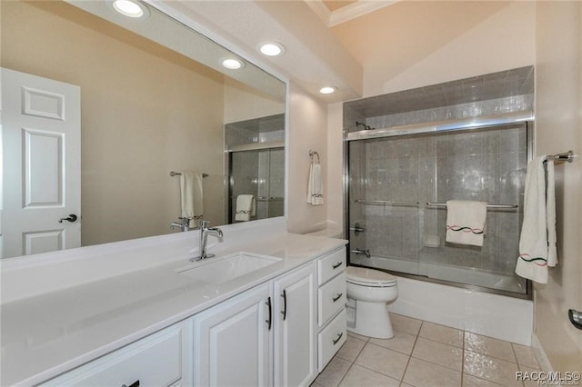 full bathroom featuring tile patterned flooring, vanity, toilet, and shower / bath combination with glass door