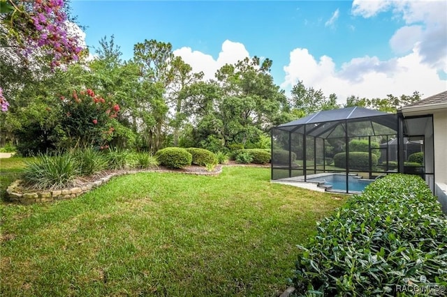 view of yard with a lanai