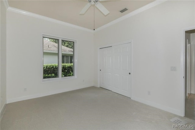 unfurnished bedroom with light carpet, a closet, and ceiling fan