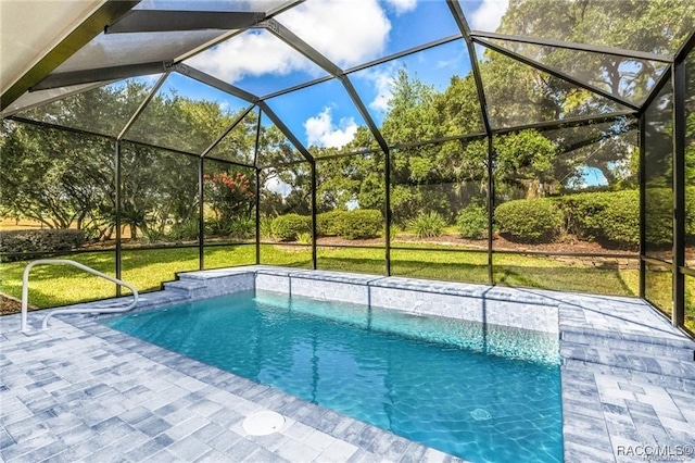 view of swimming pool featuring a lawn and glass enclosure