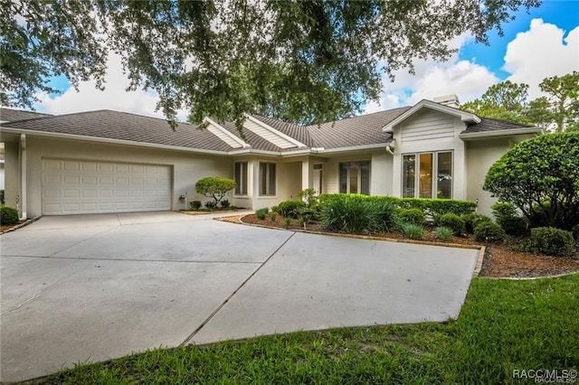 ranch-style home featuring a garage