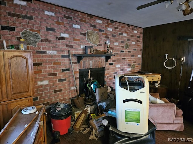 interior space featuring a fireplace, wood-type flooring, and wood walls