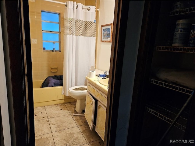 full bathroom with shower / tub combo, vanity, toilet, and tile patterned floors