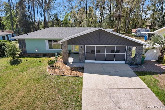 view of front of house featuring an attached garage, concrete driveway, stone siding, stucco siding, and a front lawn