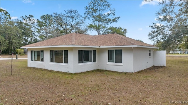 view of property exterior with a yard