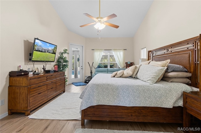 5705 N Bedstrow Blvd, Beverly Hills, FL 34465 - bedroom with high vaulted ceiling, wood finished floors, access to exterior, and a ceiling fan