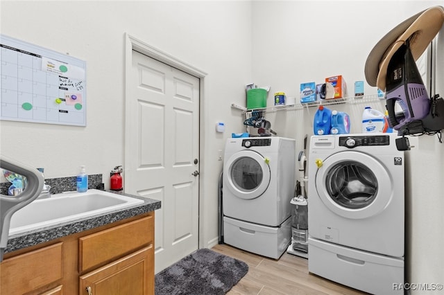 5705 N Bedstrow Blvd, Beverly Hills, FL 34465 - laundry room featuring independent washer and dryer and light wood-style flooring