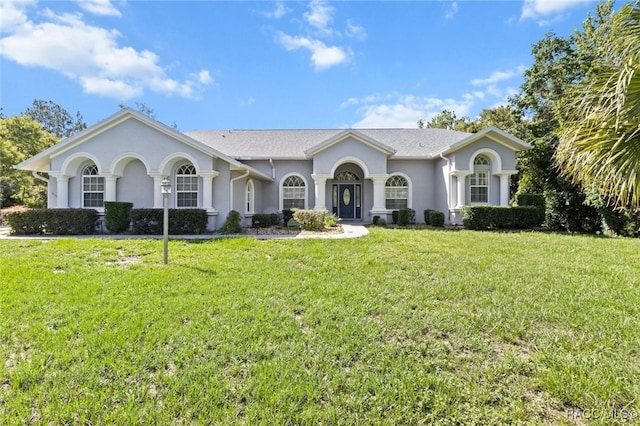 5705 N Bedstrow Blvd, Beverly Hills, FL 34465 - ranch-style house featuring stucco siding and a front yard