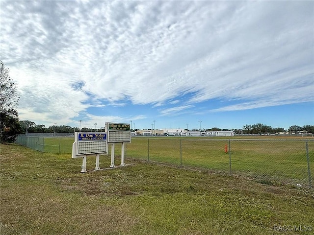 view of home's community featuring a yard