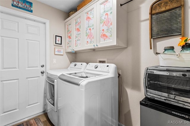 9973 N Chelic Dr, Citrus Springs, FL 34434 - laundry room with independent washer and dryer, cabinet space, and wood finished floors