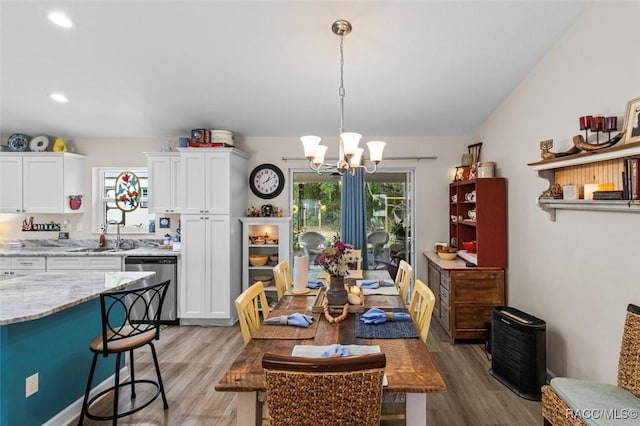 9973 N Chelic Dr, Citrus Springs, FL 34434 - dining room featuring a chandelier, light wood-type flooring, and recessed lighting