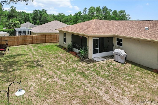 9973 N Chelic Dr, Citrus Springs, FL 34434 - rear view of property with a shingled roof, stucco siding, and a sunroom
