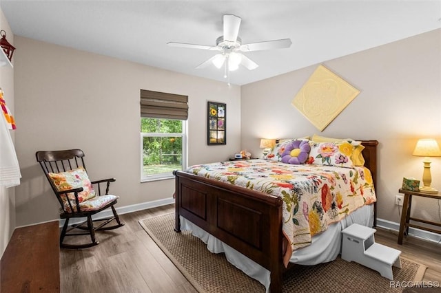 9973 N Chelic Dr, Citrus Springs, FL 34434 - bedroom with wood finished floors, baseboards, and a ceiling fan