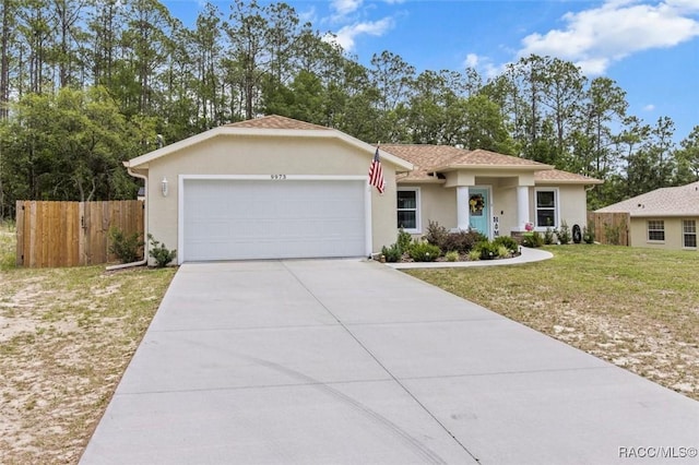9973 N Chelic Dr, Citrus Springs, FL 34434 - ranch-style house with an attached garage, stucco siding, and driveway